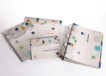Kit de treinamento de apostilas e fichários feitos para migração Itaú Unibanco